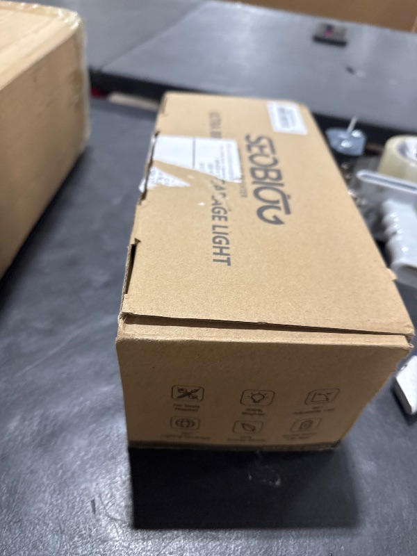 Photo 1 of SEOBIOG 2 Pack Plug in Garage Light, Upgraded 200W 20000LM Linkable LED Shop Light, 6500K Ceiling Lights w/ 6 Deformable Panels for Garage, Warehouse, Barn, Basement (Built-in ON/Off Switch)