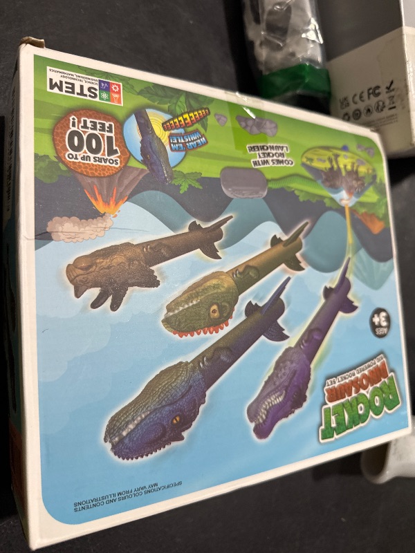Photo 1 of Gizzjoy Dinosaur Toy Rocket Launcher for Kids - Launch Up to 100 Ft, 4 Rockets, Outdoor Outside Toys for Kids, Dinosaur Toys, Birthday Gifts for 3 4 5 6 7 8-12 Year Old Boys Girls