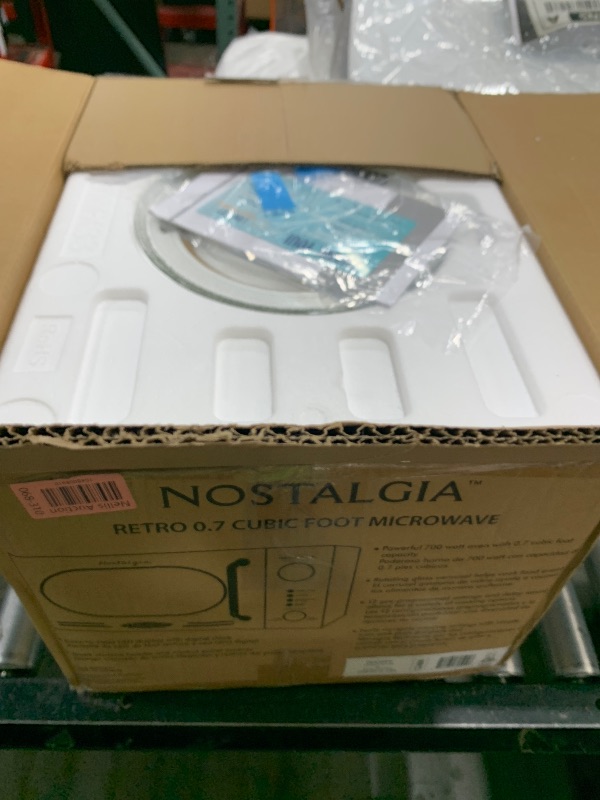 Photo 1 of Nostalgia 0.7 Cu. Ft. Retro Compact Countertop Microwave Oven, Ivory