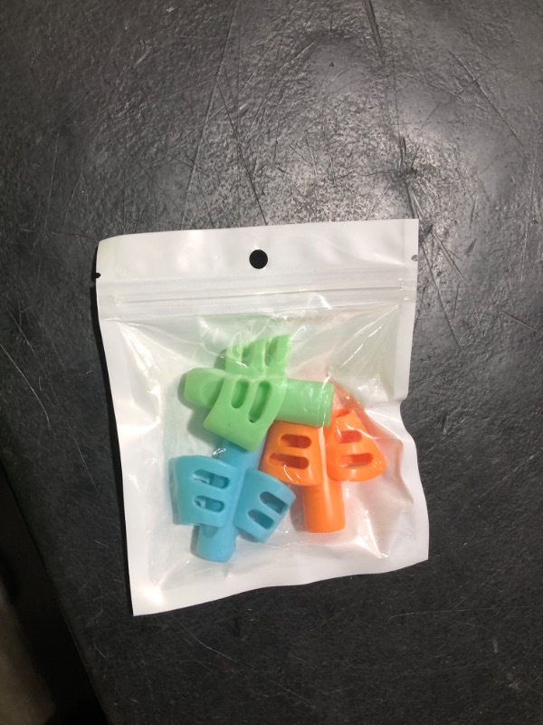 Photo 1 of JuneLsy Pencil Grips for Kids Handwriting Pencil gripper Pencil Holder Posture Correction Training Writing AIDS for preschooler Kids toddler Children Special Needs (3 PCS)