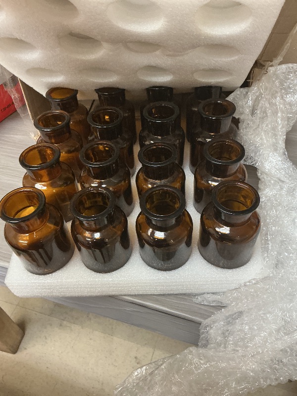Photo 1 of TOPZEA Set of 16 Amber Glass Bud Vases, 8.5 oz Small Brown Bud Vase Bulk Boho Glass Vase Decorative Medicine Bottle Vintage Apothecary Jar for Flower, Wedding Reception, Table Centerpieces, Home Decor