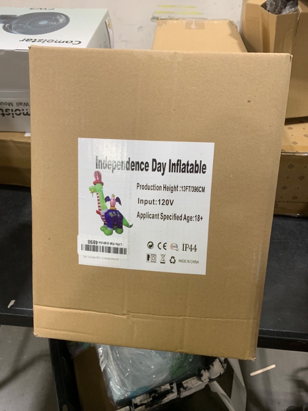 Photo 1 of InfleasJoiy 13ft 4th of July Dinosaur with Flag in Mouth, Built-in LED Lights to Light Up Your Yard, Outdoor Inflatable Decorations for Indoor and Outdoor Independence Day Parties