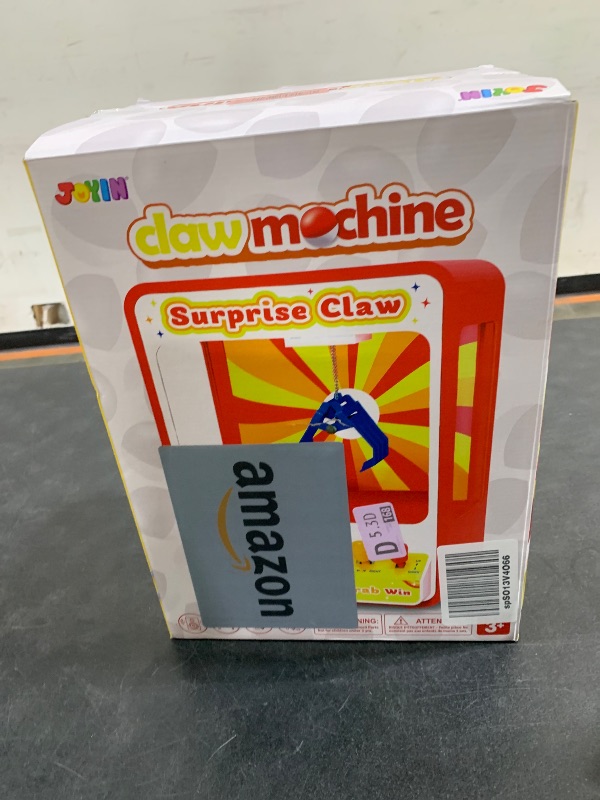 Photo 1 of JOYIN Claw Machine Arcade Toy with LED Light & Adjustable Sound, Rechargable Dispenser Toys Mini Vending Machine for Kids - Perfect Christmas & Birthday Big Gifts for Kids, Ages 3+