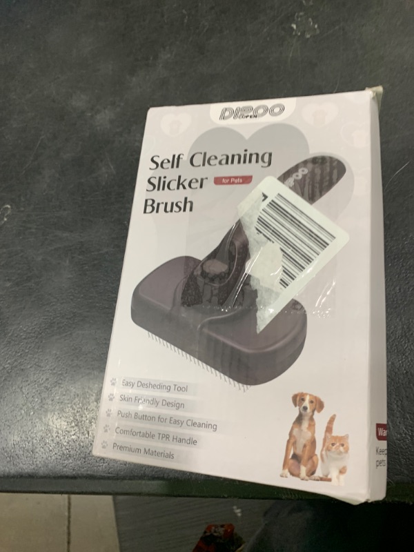 Photo 1 of Dipoo Self Cleaning Shedding Brush - Skin Friendly Grooming Tool for Dogs, Cats, and Puppies, Deshedding and Hair Removal for Long and Short Haired Pets, Black