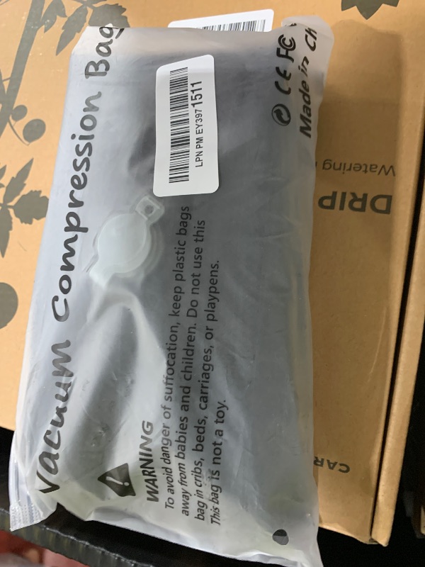 Photo 1 of Luvan Travel Vacuum Bags for Luggage with Wireless Pump, Reusable Space Saver 33L Compression Clothing Packing Storage Organizer Cube for Carry On Suitcases and Backpack, IP67 Waterproof (1PC+1 Pump)