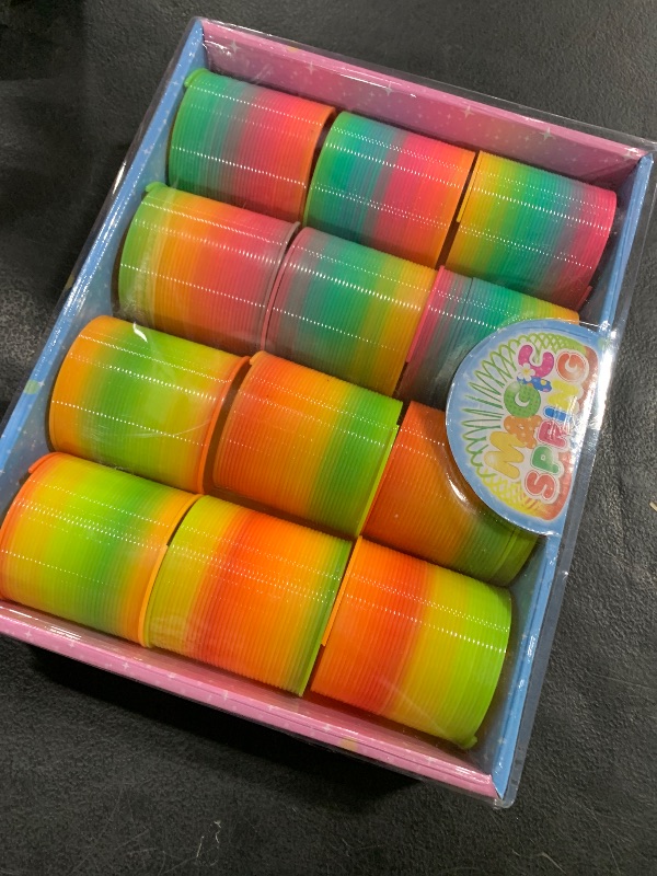 Photo 1 of JOHOUSE Rainbow Magic Spring Party Favors for Kids, 12 PCS Colorful Plastic Spring Toy, Treasure Box Toys for Classroom, Fun Goodie Bags Stuffers for Kids Birthday