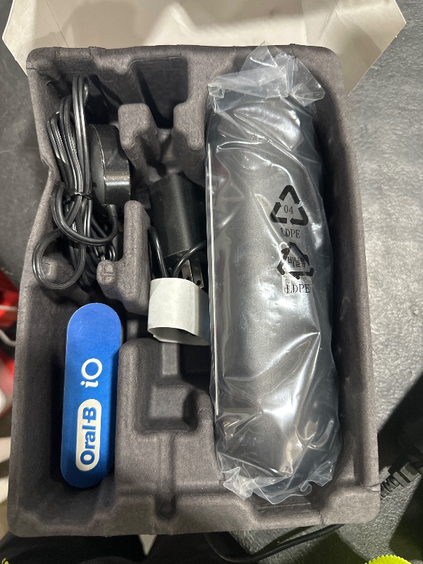 Photo 1 of Oral-B iO Deep Clean + Protect Rechargeable Electric Toothbrush, Black with a iO Series 7 Toothbrush, 2 Replacement Brush Heads, and a Charging Travel Case