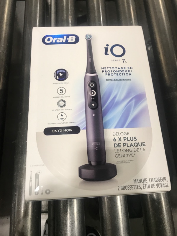 Photo 1 of Oral-B iO Deep Clean + Protect Rechargeable Electric Toothbrush, Black with a iO Series 7 Toothbrush, 2 Replacement Brush Heads, and a Charging Travel Case