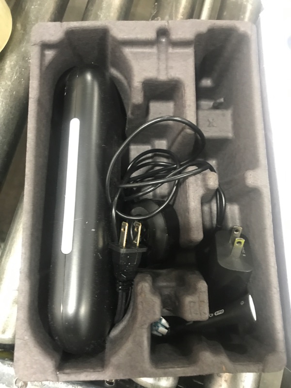 Photo 1 of Oral-B iO Deep Clean + Protect Rechargeable Electric Toothbrush, Black with a iO Series 7 Toothbrush, 2 Replacement Brush Heads, and a Charging Travel Case