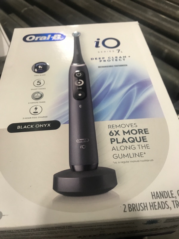 Photo 1 of Oral-B iO Deep Clean + Protect Rechargeable Electric Toothbrush, Black with a iO Series 7 Toothbrush, 2 Replacement Brush Heads, and a Charging Travel Case