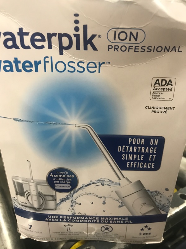 Photo 1 of Waterpik ION Professional Water Flosser, Rechargeable and Portable for Teeth, Gums, Braces, 10 Settings, 7 Flossing Tips For Multiple Users And Needs, ADA Accepted, WF-12 White, Packaging May Vary