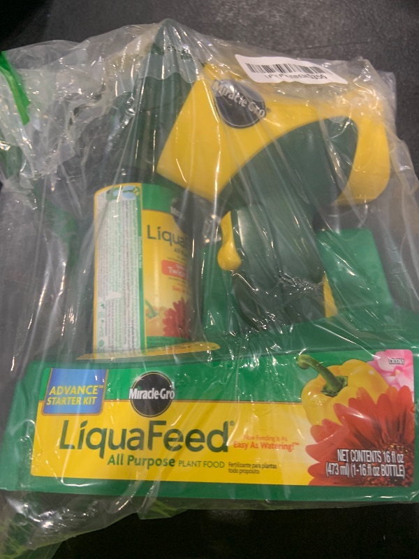 Photo 1 of Miracle-Gro LiquaFeed All Purpose Plant Food Advance Starter Kit, For Flowers, Vegetables, Trees and Shrubs, One 16 oz. Plant Food and One Feeder