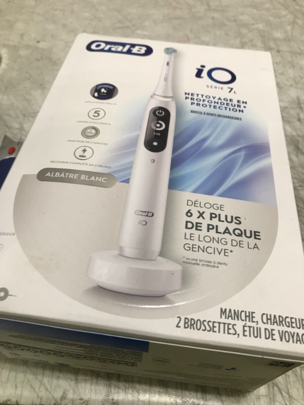 Photo 1 of Oral-B iO Deep Clean + Protect Rechargeable Electric Toothbrush, White with a iO Series 7 Toothbrush, 2 Replacement Brush Heads, and a Charging Travel Case