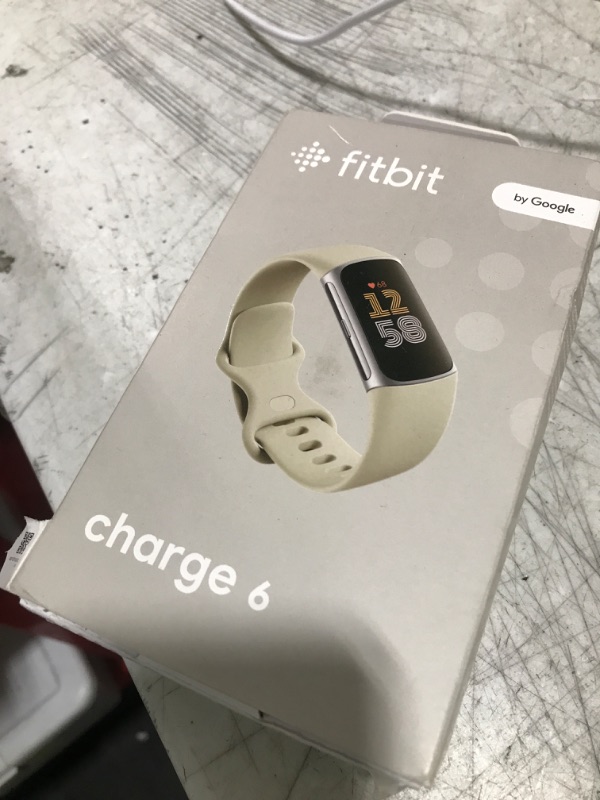 Photo 1 of Fitbit Charge 6 Fitness Tracker with Google apps, Heart Rate on Exercise Equipment, 6-Months Premium Membership Included, GPS, Health Tools and More, Porcelain/Silver, One Size (S & L Bands Included)