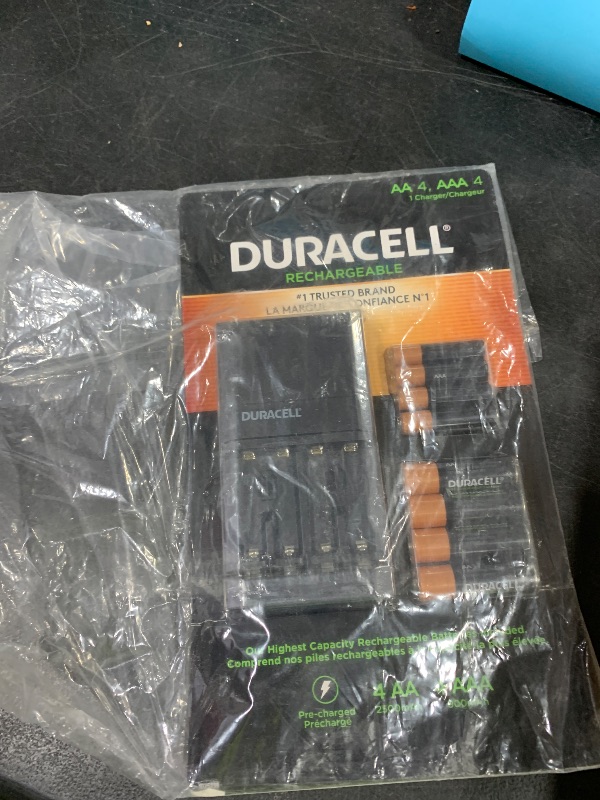 Photo 1 of Duracell Charger with Four AA and Four AAA Rechargeable Batteries