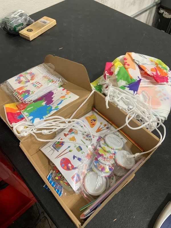 Photo 1 of Jenaai 102 Pcs Art Paint Party Favor Supplies Set Includes 12 Drawstring Backpacks 12 Silicone Bracelets 12 Badges 12 Keychains 18 Spiral Notepads 12 Bendable Pencils 12 Stickers and 12 Necklaces