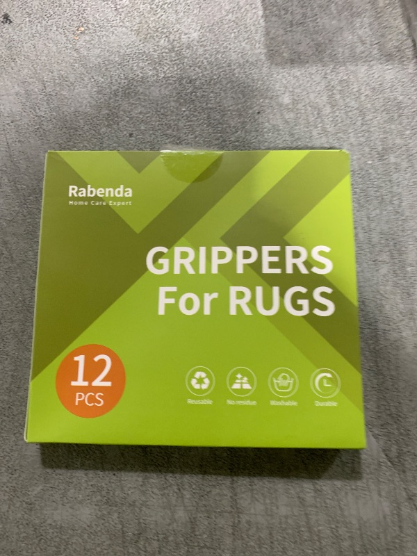 Photo 1 of Rabenda 12 Pcs Rug Tape, Non Slip Rug Pads Grippers for Hardwood Floors and Tiles, Reusable Carpet Tape for Area Rugs, Double-Sided Adhesive Rug Stickers Keep Corners Flat (Black)