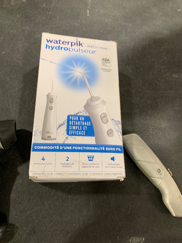 Photo 1 of Waterpik Cordless Pearl Rechargeable Portable Water Flosser for Teeth, Gums, Braces Care and Travel with 4 Flossing Tips - ADA Accepted, WF-13 White, Packaging May Vary