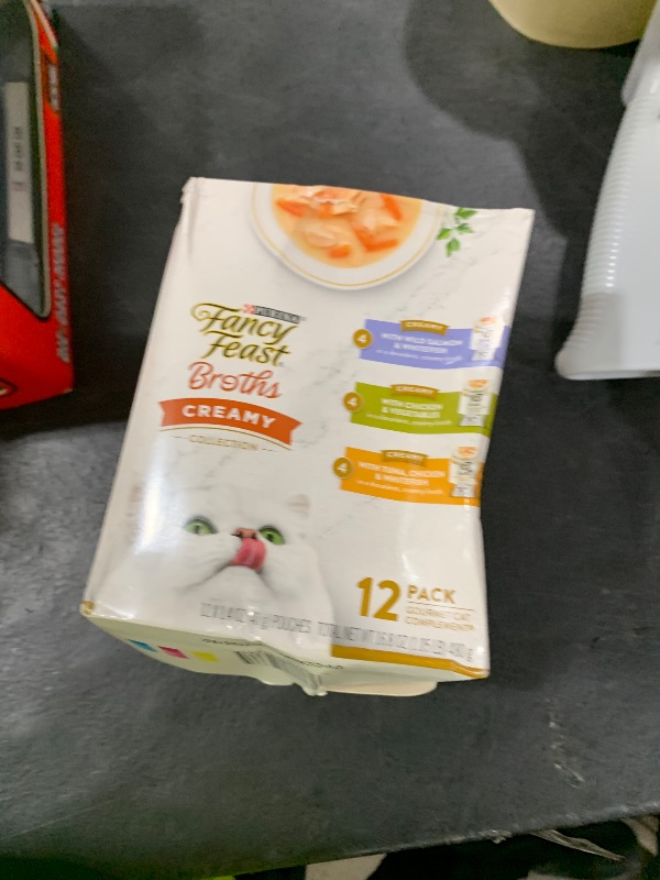 Photo 1 of Purina Fancy Feast Lickable Broth Topper Complement Creamy Wet Cat Food Variety Pack - (Pack of 12) 1.4 oz. Pouches