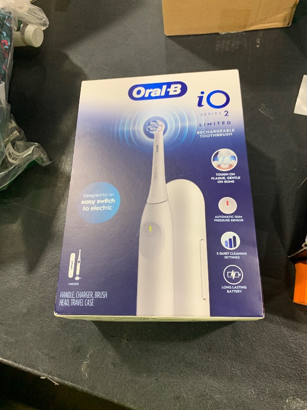 Photo 1 of Oral-B iO Simple Clean Rechargeable Electric Powered Toothbrush, Pure White with 1 Gentle Care Brush Head and 1 White Travel Case - Automatic Pressure Sensor to Protect Gums - 3 Modes -2 Min Timer