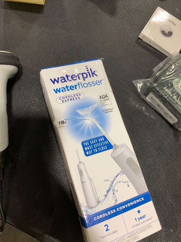 Photo 1 of Waterpik Cordless Express Water Flosser, Battery Operated & Portable for Travel & Home, ADA Accepted, Waterproof for Shower Use, White WF-02, Packaging May Vary