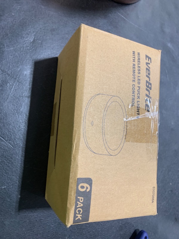 Photo 1 of EverBrite Puck Lights with Remote, Wireless LED Battery Operated, Under Cabinet Timer, Stick on Light, Closet Light Dimmable for Closet, Bedroom, Included (6-Pack)