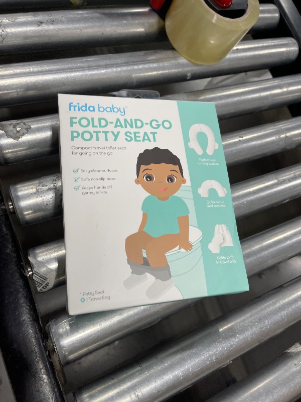 Photo 1 of Frida Baby Fold-and-Go Portable Potty Seat for Toilet, Foldable Travel Potty Seat for Toddler, Fits Round & Oval Toilets, Non-Slip Base, Handles, Includes Free Travel Bag
