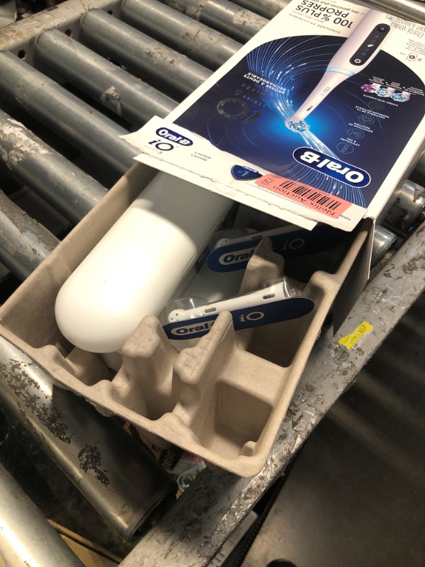 Photo 1 of Oral-B iO Deep Clean + Whiten Rechargeable Electric Toothbrush with Visible Pressure Sensor, 2 Minute Timer, 5 Cleaning Settings, 1 iO5 Limited, 3 Toothbrush Heads, Travel Case & Refill Holder, White