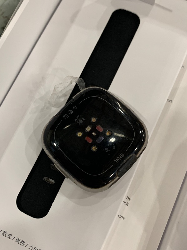 Photo 1 of *** PARTS ONLY *** Fitbit Versa 4 Fitness Smartwatch with Daily Readiness, GPS, 24/7 Heart Rate, 40+ Exercise Modes, Sleep Tracking and more, Black/Graphite, One Size (S & L Bands Included)