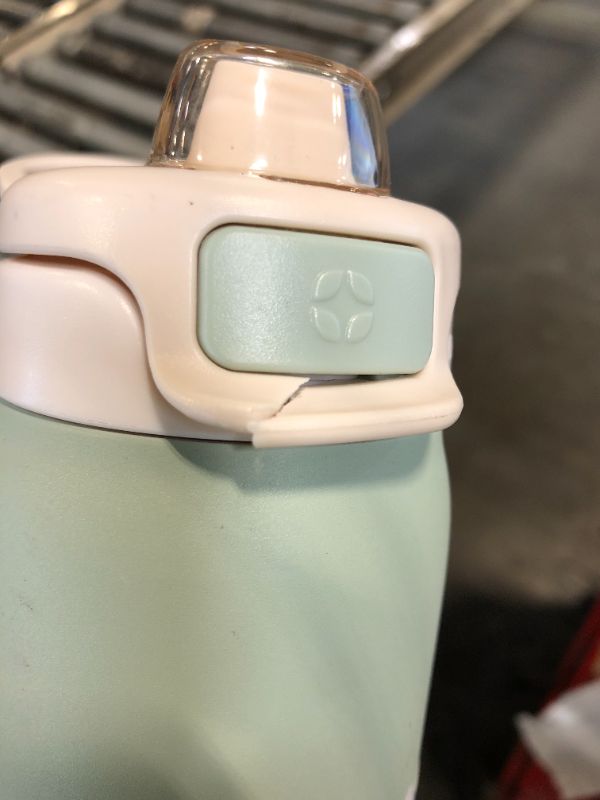 Photo 1 of ***CAP BROKEN***Ello Pop & Fill 22oz Stainless Steel Water Bottle with Quick Fill Technology, Double Walled and Vacuum Insulated Metal, Leak Proof Locking Lid, Sip and Chug, Reusable, BPA Free, Pistachio