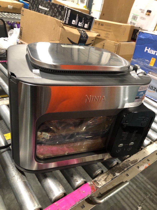 Photo 1 of ****THE DOOR CORNER IS A LITTLE BROKEN, BUT IT OPENS WELL AND IS NEW*****Ninja Combi All-in-One Multicooker, Oven, & Air Fryer, Complete Meals in 15 Mins, 14-in-1 Functions, Combi Cooker + Air Fry, Bake, Roast, Slow Cook and More, 3 Accessories, Stainless