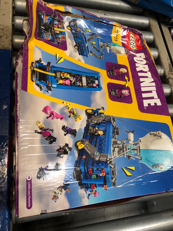Photo 1 of **damaged box**LEGO Fortnite Battle Bus - Collectible Fortnite Toy for Kids, Boys and Girls, Ages 10+ - Pretend Play Set with 9 Minifigures from Video Game - Gift Ideas for Fans - 77073