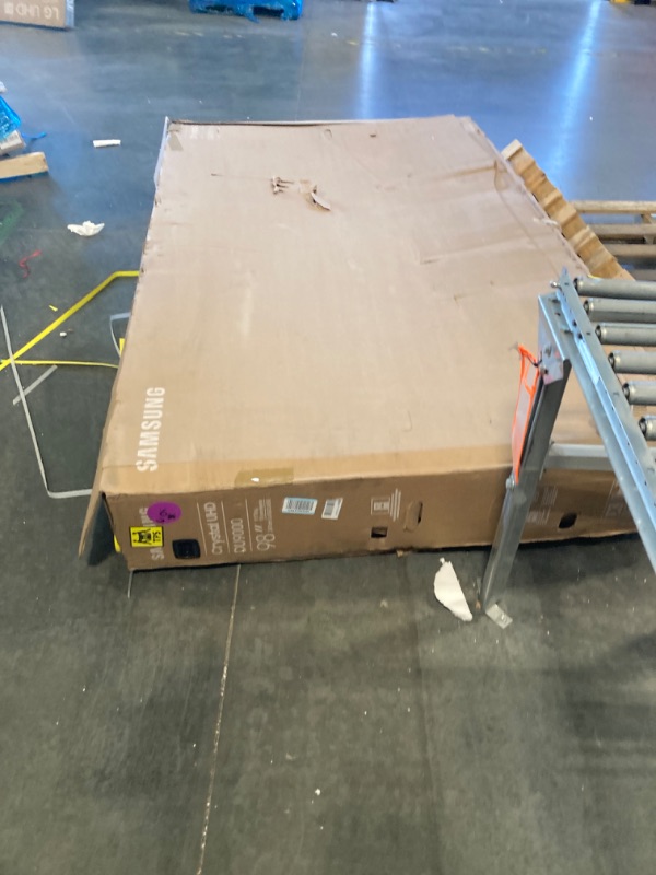 Photo 1 of **Tv has a big crack on the back casing panel**
Samsung 98-Inch Class 4K Crystal UHD DU9000 Series HDR Smart TV, Object Tracking Sound Lite, Motion Xcelerator 120Hz, Supersize Picture Enhancer, Mega Contrast, Alexa Built-In (UN98DU9000, 2024 Model)