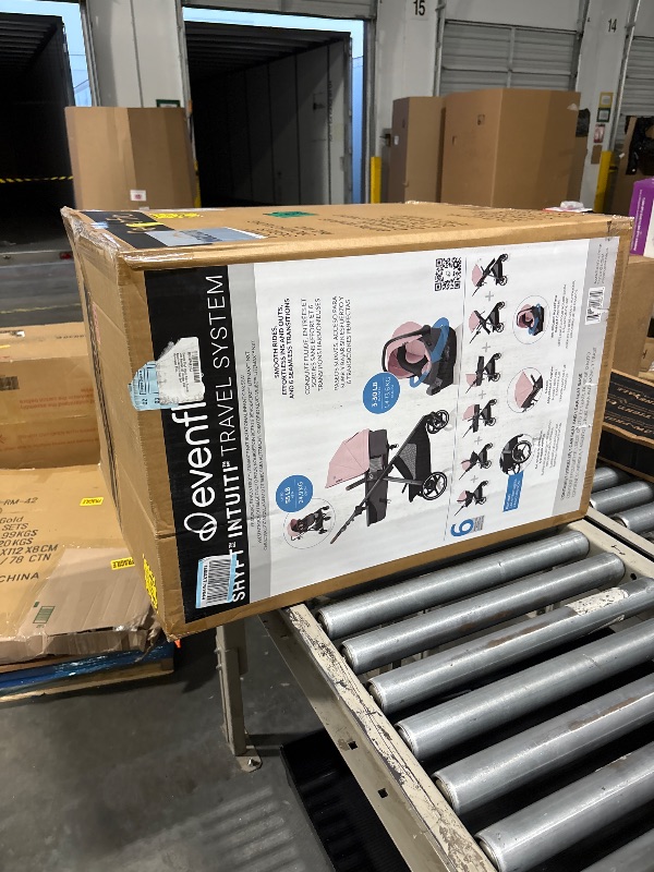 Photo 1 of **FACTORY SEALED-OPENED IN NELLIS WAREHOUSE**
Evenflo  Intuiti Travel System with Revolve180 LiteMax NXT Rotational Infant Car Seat (Amaranth Pink)