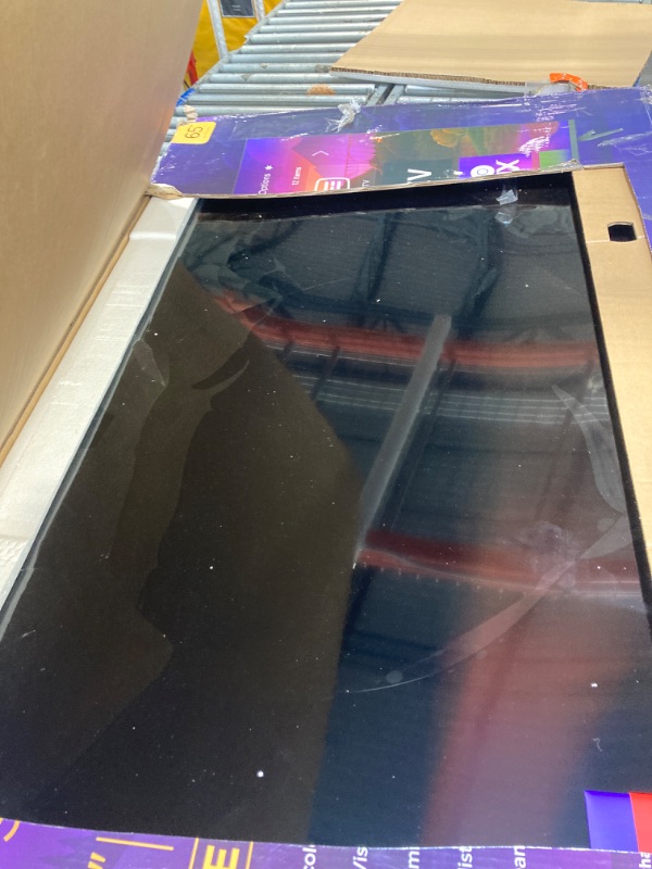 Photo 1 of **FOR PARTS ONLY!** MAJOR DAMAGE! Roku Smart TV – 65-Inch Plus Series 4K QLED RokuTV with Roku Voice Remote Pro, Dolby Vision, Striking 4K Resolution, Automatic Brightness, & Seamless Streaming – Live Local News & Sports