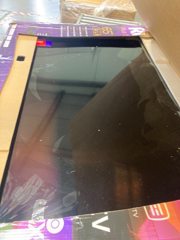 Photo 1 of **FOR PARTS ONLY!** MAJOR DAMAGE! Roku Smart TV – 65-Inch Plus Series 4K QLED RokuTV with Roku Voice Remote Pro, Dolby Vision, Striking 4K Resolution, Automatic Brightness, & Seamless Streaming – Live Local News & Sports