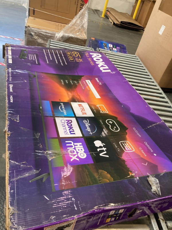 Photo 1 of **FOR PARTS ONLY!** MAJOR DAMAGE! Roku Smart TV – 65-Inch Plus Series 4K QLED RokuTV with Roku Voice Remote Pro, Dolby Vision, Striking 4K Resolution, Automatic Brightness, & Seamless Streaming – Live Local News & Sports