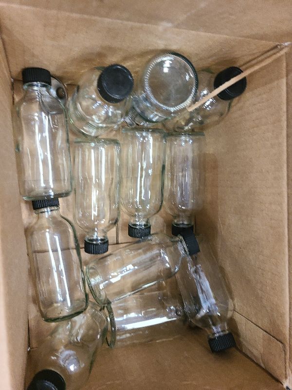 Photo 1 of 4 OZ Glass Bottles with Lids, 12Pcs Small Glass Containers with Lids and 3 Stainless Steel Funnels Clear Reusable Decorative Bottles for Juice Wellness Ginger Shots Whiskey Homemade Vanilla (4OZ)