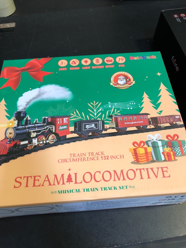Photo 1 of BainGesk Train Set, Christmas Train Set with Steam, Light and Sounds, Electric Train Toy for Boys & Girls, Christmas Train Set for Under The Tree, Gifts for 3 4 5 6 7 8 Year Old Kids