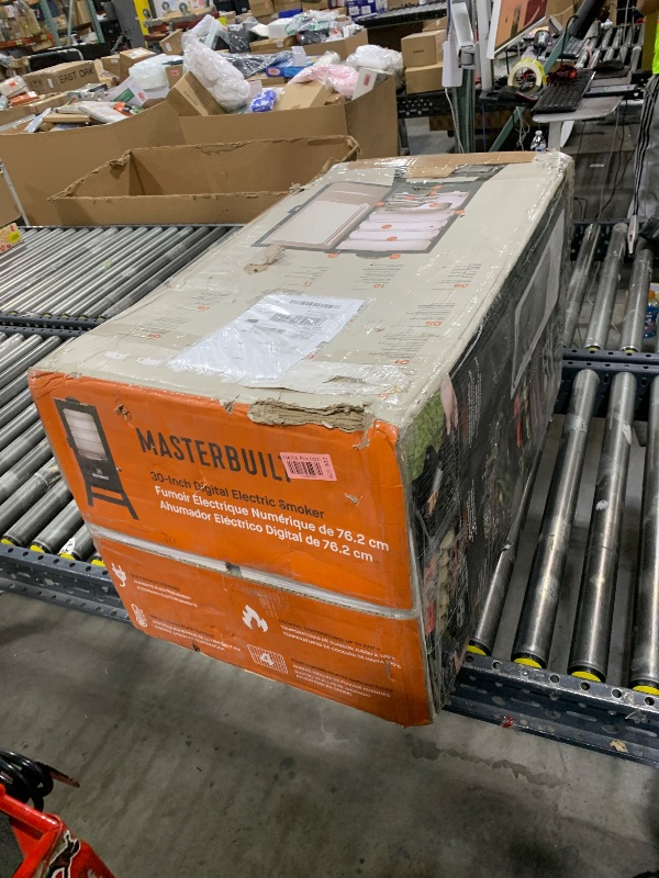 Photo 1 of Masterbuilt® 30-inch Digital Electric Vertical BBQ Smoker with Leg Kit, Side Wood Chip Loader and 710 Cooking Square Inches in Black, Model MB20070421