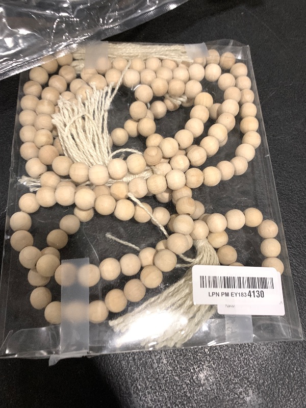 Photo 1 of DECORKEY Farmhouse Wood Beads Garland, 2 Pack 58 Inch Wooden Beads for Boho Home Decor with Tassels, Rustic Country Decor for Coffee Table, Wall, Shelf, Tray, Vase, Living Room, Bedroom