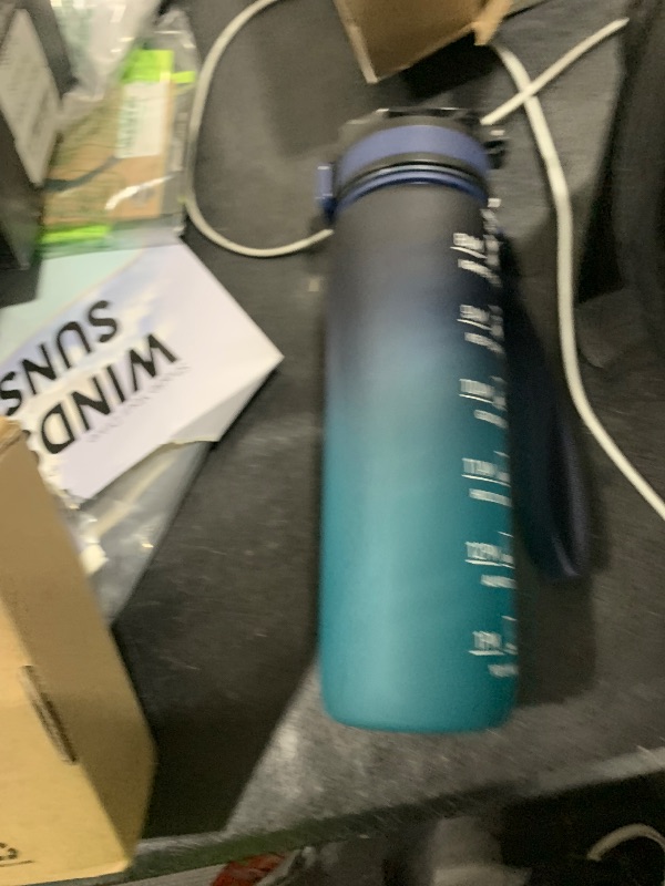 Photo 1 of QLUR Water Bottle with Straw, 32oz Motivational Water Bottles with Time Marker to Drink, Tritan BPA Free, 1L Sports Water Bottle with Carry Strap LeakProof for Women Gym Fitness Outdoor (1 Pack)
