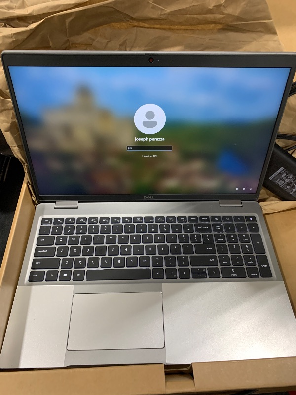 Photo 1 of DELL LAPTOP - LOCKED W PASSCODE WILL NEED A HARD RESET. ITEM IS ONLY IN A ASUS BOX. LAPTOP IS NOT ASUS BRAND