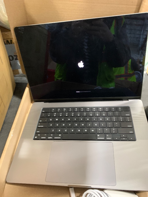 Photo 1 of Apple MacBook Pro Late 2021 with Apple M1 Pro chip (16-inch, 16GB RAM, 512GB SSD) Space Gray (Renewed)