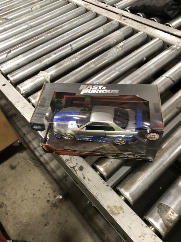 Photo 1 of Jada Toys Fast & Furious Brian’s 2002 Nissan Skyline R34 Die-cast Car, 1:24 Scale, Silver & Blue,19808