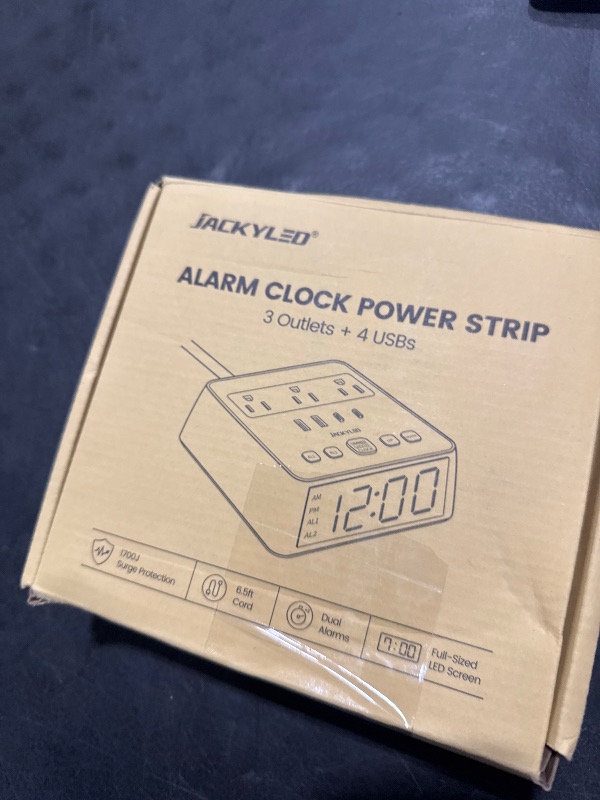 Photo 1 of JACKYLED Alarm Clock with 4 USB Chargers Power Strip 3 Outlets 1700J Surge Protector Nightstand Dimmable Digital Clock with Dual Alarm and Snooze Function for Bedroom, Full Screen LED Display