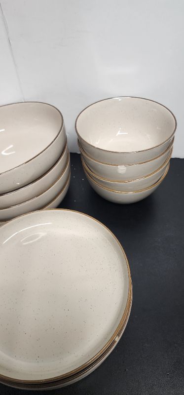 Photo 1 of Over&Back Options 16-Piece Dinnerware Set of Plates & Bowls (small chips in some of the plates)