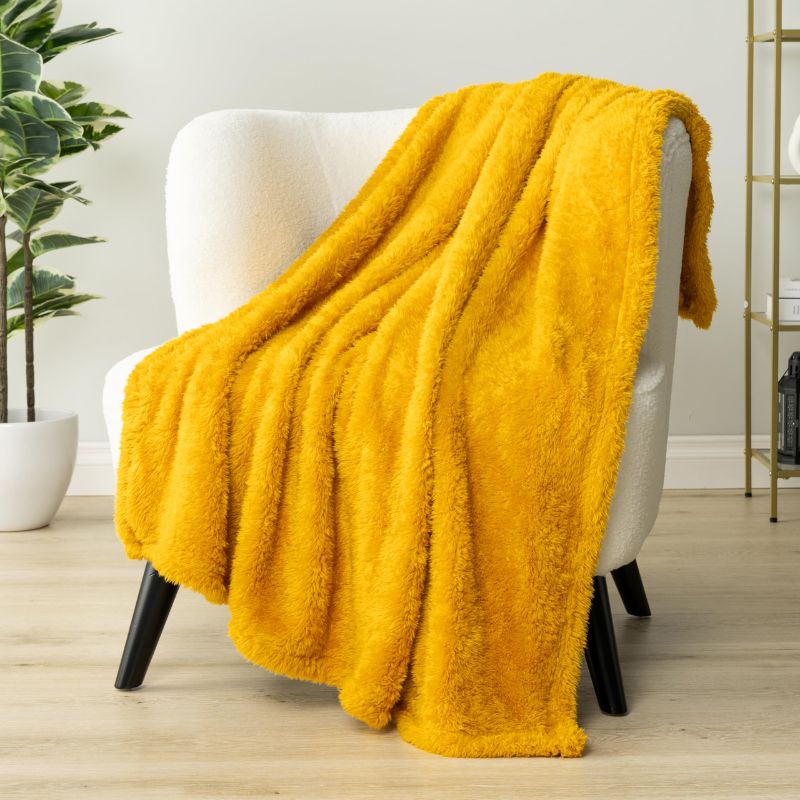 Photo 1 of PAVILIA Sherpa Throw Blanket for Couch Sofa, Mustard Yellow Fluffy Warm Plush Blanket for Bed, Cozy Super Soft Lightweight Throw, Fuzzy Decorative Blanket, All Season Home, 50x60

