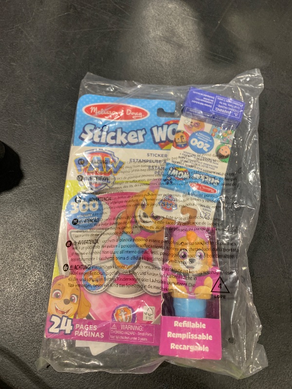 Photo 1 of Melissa & Doug Sticker Wow!™ PAW Patrol Skye Bundle: 24-Page Activity Pad, Sticker Stamper, 500 Stickers, Mini Pad, Arts and Crafts Fidget Toy Collectible Character