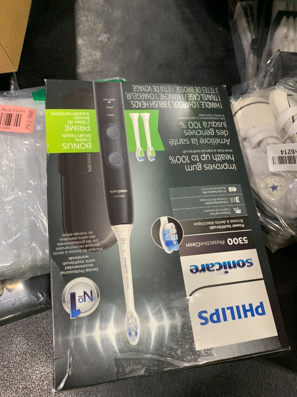 Photo 1 of Philips Sonicare ProtectiveClean 5300 Rechargeable Electric Toothbrush, with Pressure Sensor, 3 Cleaning Modes, SmarTimer and QuadPacer, with 2 Bonus Brush Heads, Travel Case, Black, Model HX6423/34